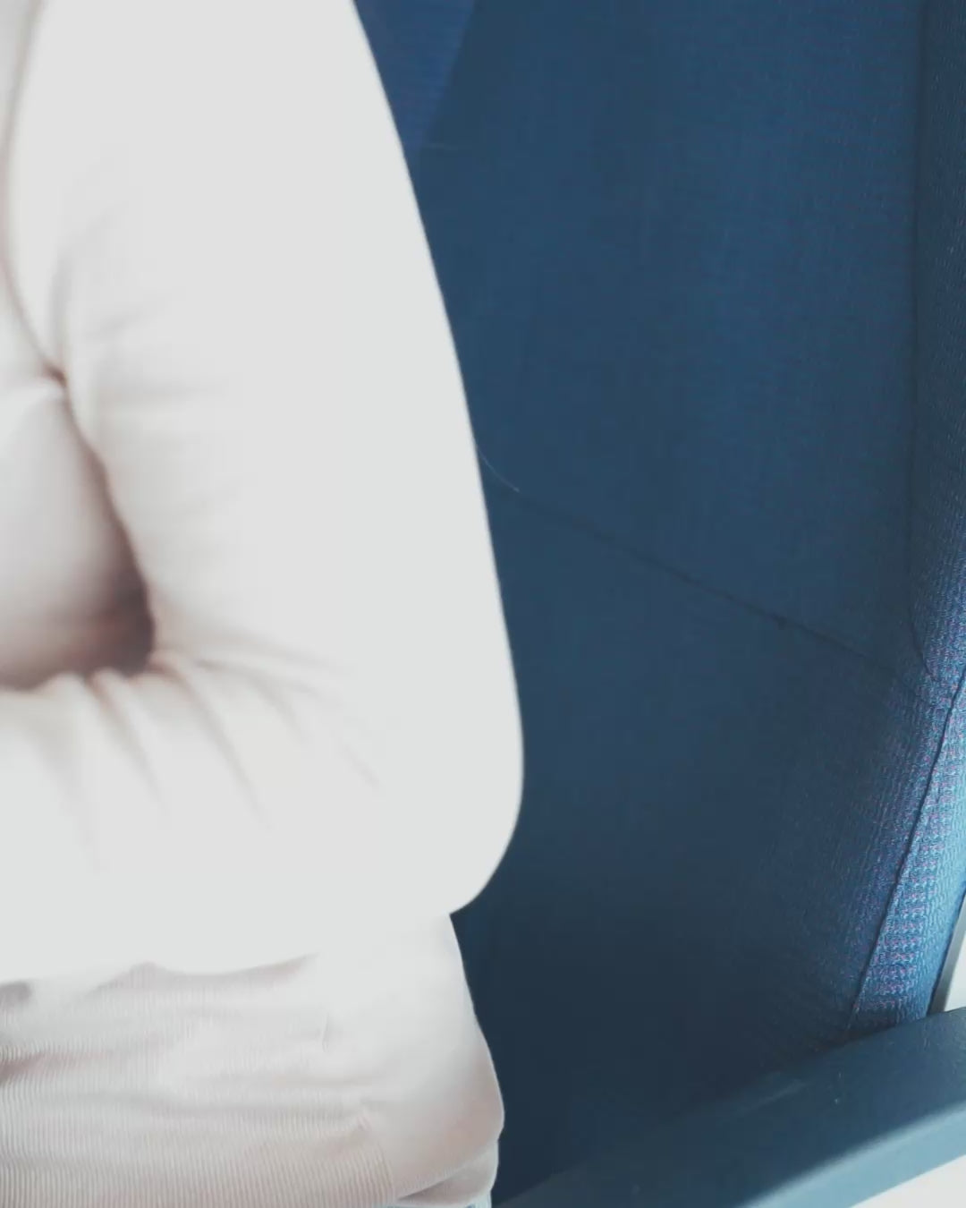 Using blanket in carrying case as lumbar support for back on airplane